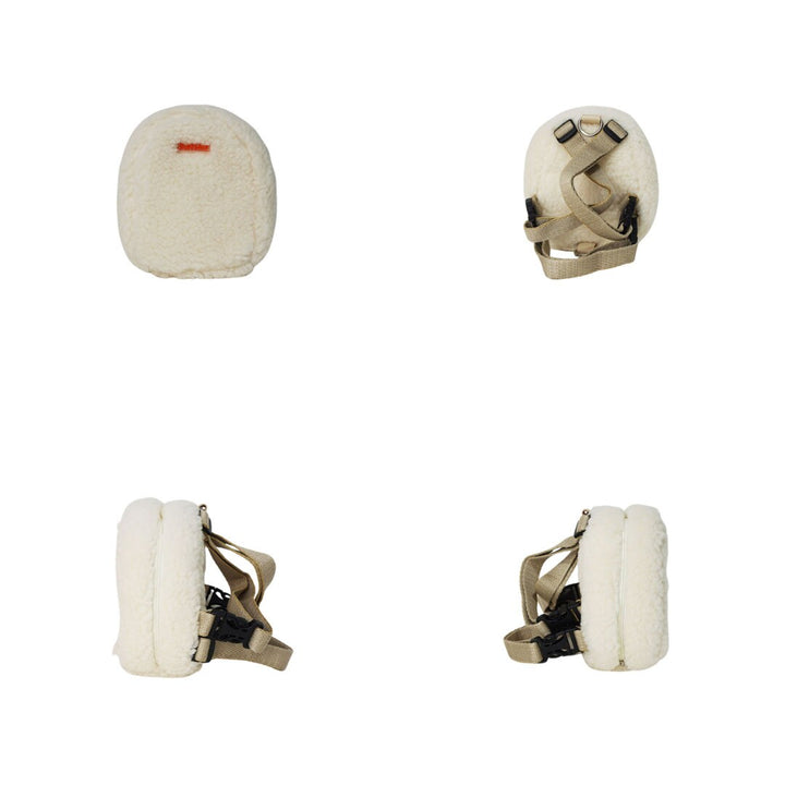 Finny Fur White model Ruffsack backpack at 4 angles including the front, back, side 1, and side 2.  The backpack features a furry, fluffy white fabric. A side zipper allows access to the inside. Straps are light tan in color.