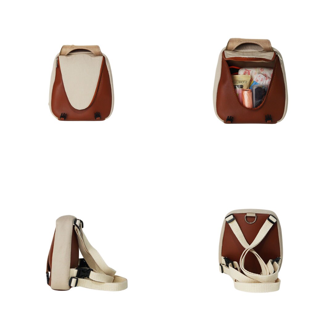 Reed model Ruffsack backpack at 4 angles including the front, back, side 1, and side 2. The backpack features a dark tan fabric atop a light tan fabric. A zipper and clips along the front center allow access to the inside. Straps are light tan in color.