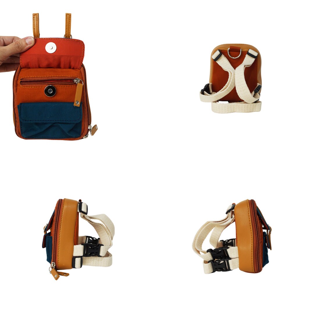 Dale Rust model Ruffsack backpack at 4 angles including the front, back, side 1, and side 2. The backpack face features a cotton dark green solid pattern with two small front buttoned pockets atop a cotton rust colored solid pattern. Tan faux leather accents are on the front and sides of the bag. A side zipper allows access to the inside. Straps are light tan in color.