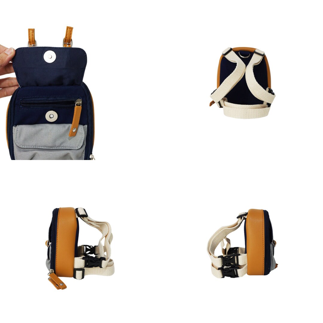 Dale Navy model Ruffsack backpack at 4 angles including the front, back, side 1, and side 2. The backpack face features a cotton gray solid pattern with two small front buttoned pockets atop a cotton navy blue solid pattern. Tan faux leather accents are on the front and sides of the bag. A side zipper allows access to the inside. Straps are light tan in color.