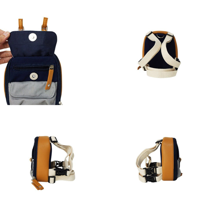 Dale Navy model Ruffsack backpack at 4 angles including the front, back, side 1, and side 2. The backpack face features a cotton gray solid pattern with two small front buttoned pockets atop a cotton navy blue solid pattern. Tan faux leather accents are on the front and sides of the bag. A side zipper allows access to the inside. Straps are light tan in color.