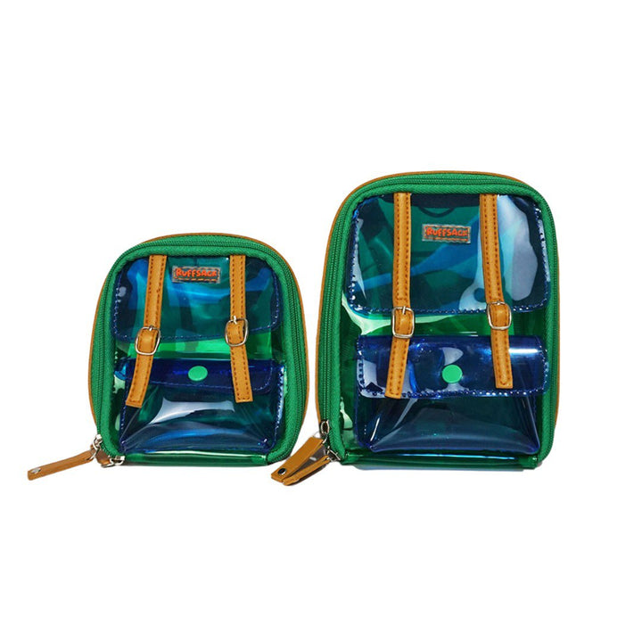 Jelly Dale, Green and Blue, model Ruffsack backpack front angle. The backpack face features a transparent blue and green plastic with a small front buttoned pocket. Tan faux leather accents are on the front and sides of the bag. A side zipper allows access to the inside.
